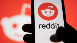 Reddit logo displayed on a smartphone device. RDDT stock