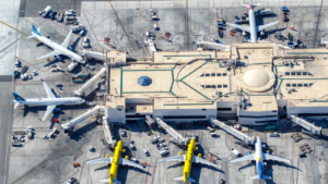 Airplanes from JetBlue (JBLU) and Spirit Airlines (SAVE) at Los Angeles Airport (LAX) aerial view in the United States.