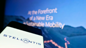 Mobile phone with logo of automotive company Stellantis N.V. (STLA) on screen in front of company website. Focus on center of smartphone screen. Unmodified photo.