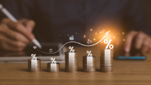 interest rates and dividends, investment returns, income, retirement Compensation fund, investment, dividend tax. pile of coins and upward direction percentage symbol. saving money for investment. Dividend stocks