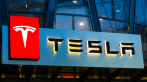 Tesla (TSLA) sign on the building on car sales