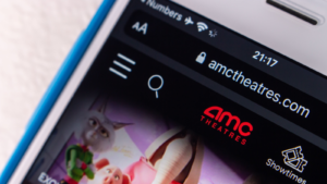 The logo of AMC Theatres, an US movie theater chain headquartered in Leawood, Kansas, on its website on an iPhone screen. AMC stock