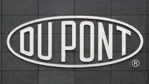 DuPont logo on a wall. DuPont is one of America's most innovative companies and it is an American chemical company that was founded in July 1802 as a gunpowder mill. DD stock