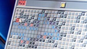 Minesweeper game with bombs and exploded frowny face, classic Microsoft computer game