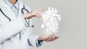 Female doctor holding virtual volumetric drawing of Heart in hand. Handrawn human organ, copy space on right side, grey hdr color. Healthcare hospital service concept stock photo. LGVN stock