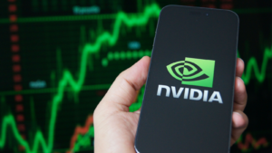 Nvidia corporation logo displayed on smartphone with stock market chart background. Nvidia is a global leader in artificial intelligence hardware. NVDA stock