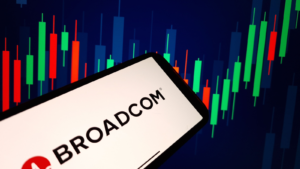 Broadcom Inc company logo displayed on mobile phone screen. AVGO stock